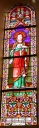 Verrières à personnages (baies 0 à 2, 7, 8, 17) : Sacré Coeur, Saint Martin de Tours, Saint Augustin, Notre-Dame de Lourdes, Sainte Anne, Saint Joseph, Saint Isidore, Baptême du Christ et verrières décoratives (baies 3 à 6, 9 à 16)